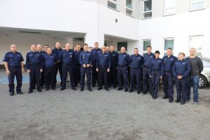Zdjęcie grupowe policjantów z komisja sędziowską.