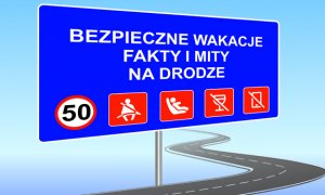 Tablica z napisem: Bezpieczne Wakacje Fakty i Mity Na Drodze