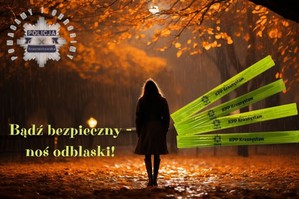 Kobieta w parkowej alejce jesienną porą po zmroku. Po prawej stronie napis Bądź bezpieczny - noś odblaski! Po prawej stronie opaski odblaskowe