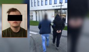 Policjant prowadzi zatrzymanego mężczyznę